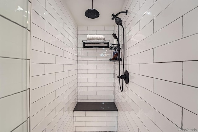 full bathroom with a tile shower
