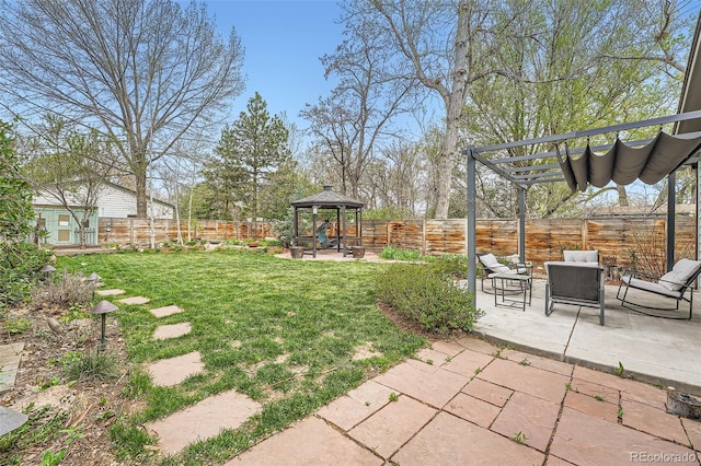 view of yard with a patio, a gazebo, a fenced backyard, and a pergola