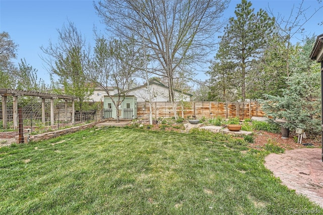 view of yard with a garden and fence