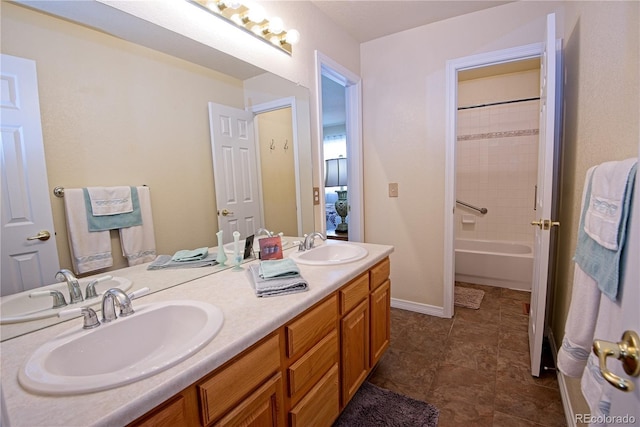 bathroom with vanity and bathtub / shower combination