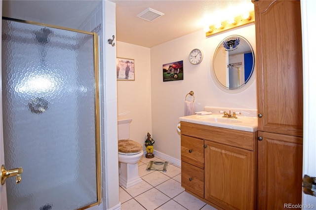 bathroom with walk in shower, vanity, tile patterned floors, and toilet