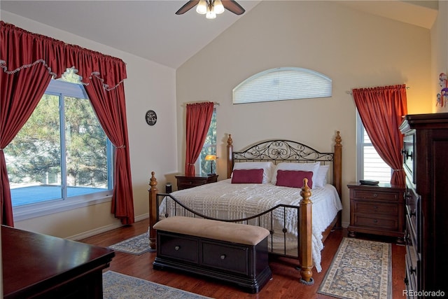 bedroom with multiple windows, high vaulted ceiling, dark wood-type flooring, and ceiling fan