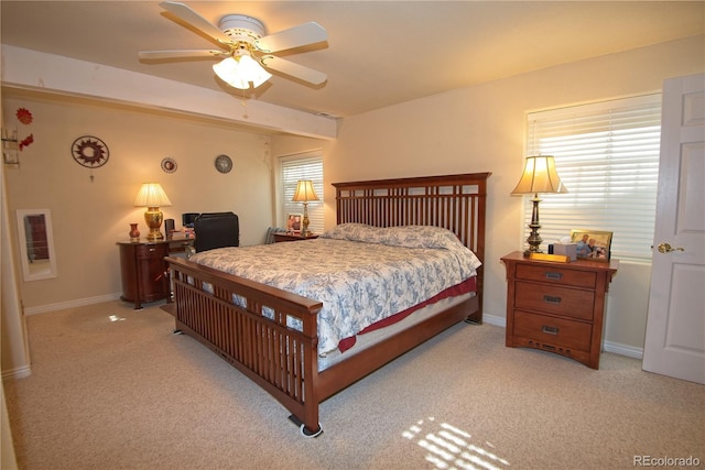 bedroom featuring light carpet and ceiling fan