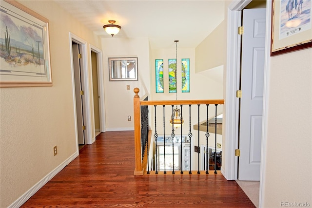 corridor with dark wood-type flooring