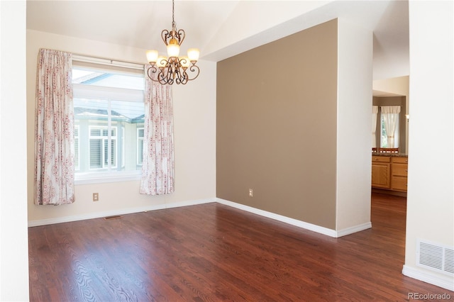 16873 Boreas Ct, Parker, CO 80134 - spare room with dark wood finished floors, a chandelier, and vaulted ceiling