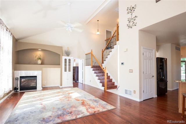 16873 Boreas Ct, Parker, CO 80134 - unfurnished living room featuring stairway, wood finished floors, a ceiling fan, and high vaulted ceiling