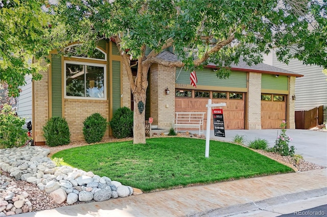 16873 Boreas Ct, Parker, CO 80134 - view of front of home with brick siding, driveway, and a front yard