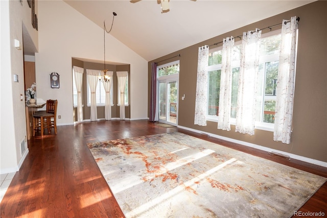 16873 Boreas Ct, Parker, CO 80134 - spare room with wood finished floors, ceiling fan, a chandelier, and high vaulted ceiling