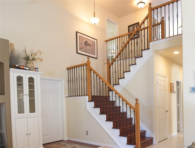 16873 Boreas Ct, Parker, CO 80134 - entryway with stairs, a towering ceiling, and light tile patterned floors