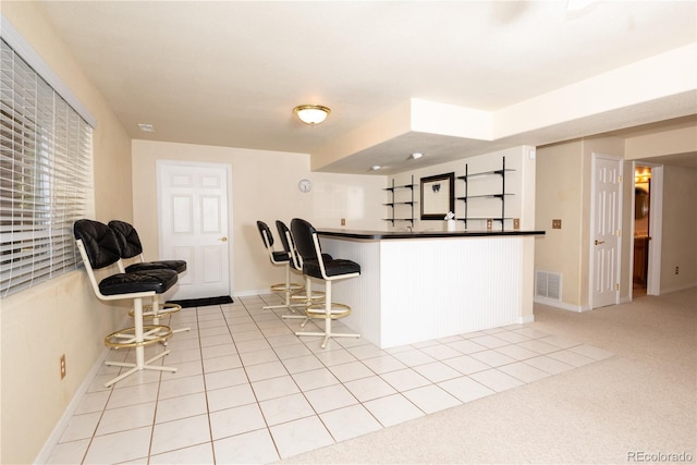 16873 Boreas Ct, Parker, CO 80134 - kitchen with a breakfast bar and dark countertops