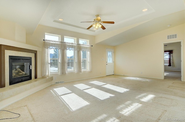 27665 County Road 313 Unit 34, Buena Vista, CO 81211 - unfurnished living room featuring carpet, plenty of natural light, a ceiling fan, a tile fireplace, and recessed lighting
