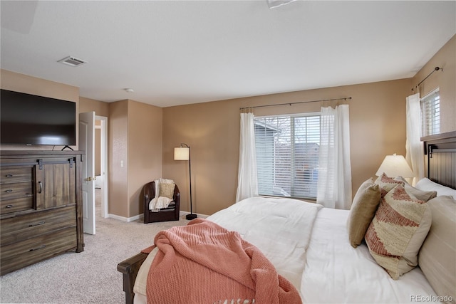 bedroom featuring carpet flooring, visible vents, and baseboards