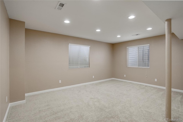 unfurnished room featuring carpet flooring, recessed lighting, visible vents, and baseboards
