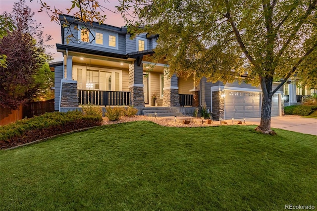 craftsman-style house featuring a lawn and covered porch