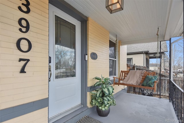 entrance to property featuring a porch