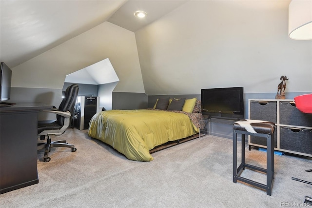 bedroom with lofted ceiling and carpet flooring