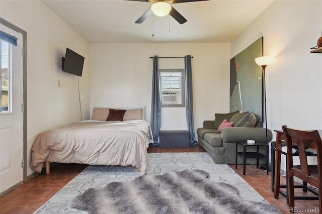 bedroom featuring cooling unit and ceiling fan