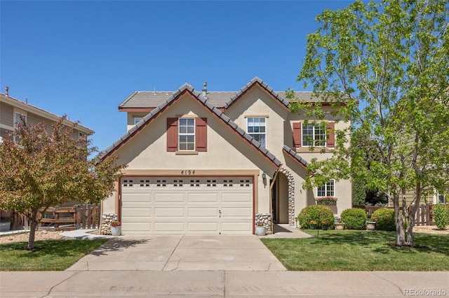 4194 Beautiful Cir, Castle Rock, CO 80109 - traditional-style house featuring driveway, stucco siding, a garage, a front yard, and a tile roof