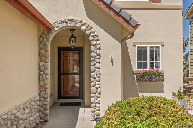 4194 Beautiful Cir, Castle Rock, CO 80109 - property entrance featuring stucco siding