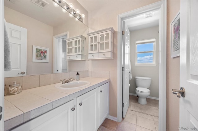 4194 Beautiful Cir, Castle Rock, CO 80109 - bathroom featuring vanity, tile patterned flooring, toilet, and baseboards