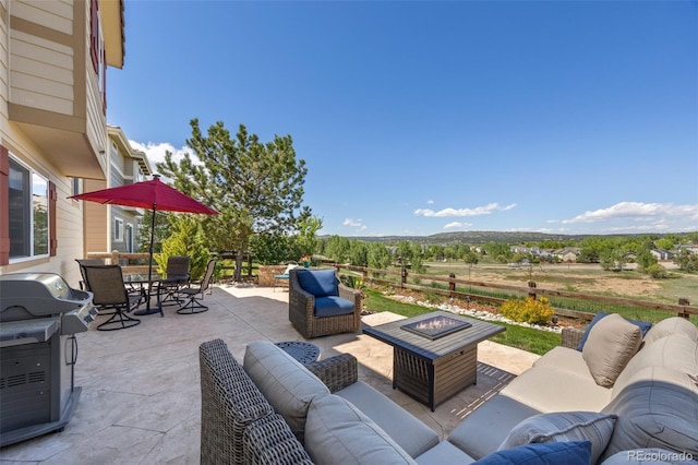 4194 Beautiful Cir, Castle Rock, CO 80109 - view of patio featuring an outdoor living space with a fire pit, area for grilling, and outdoor dining area