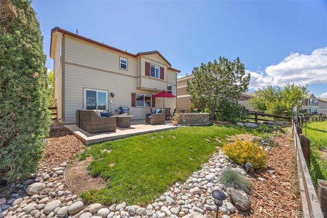 4194 Beautiful Cir, Castle Rock, CO 80109 - back of property with an outdoor hangout area and a patio