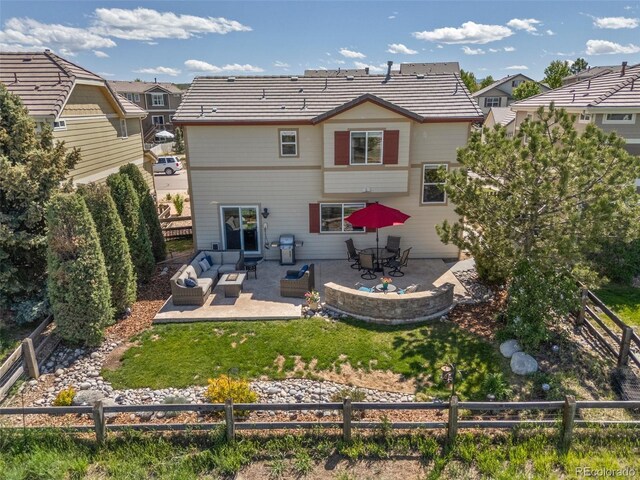 4194 Beautiful Cir, Castle Rock, CO 80109 - rear view of property featuring an outdoor living space, a fenced backyard, and a patio area