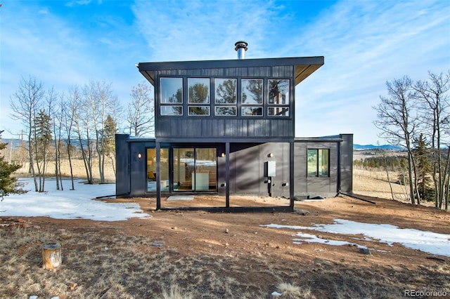 rear view of house with a sunroom