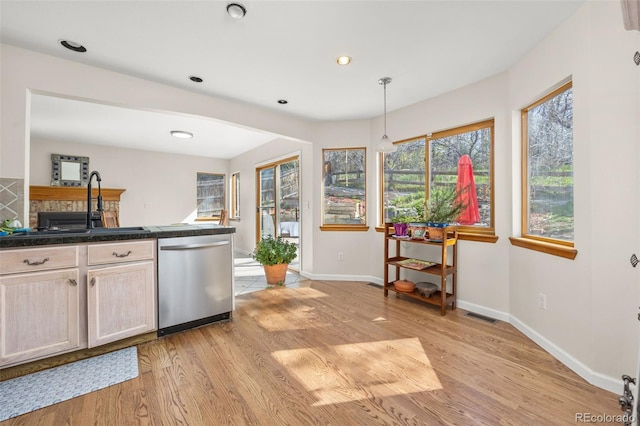 6868 Johnson St, Arvada, CO 80004 - kitchen featuring dishwasher, light wood-type flooring, baseboards, dark countertops, and recessed lighting