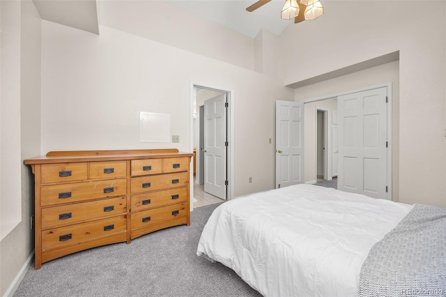 6868 Johnson St, Arvada, CO 80004 - bedroom with light colored carpet, high vaulted ceiling, baseboards, and ceiling fan
