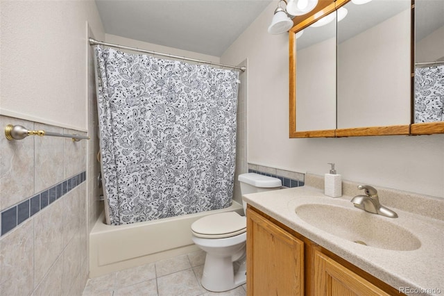 6868 Johnson St, Arvada, CO 80004 - full bathroom with vanity, shower / bath combo with shower curtain, toilet, and tile patterned floors