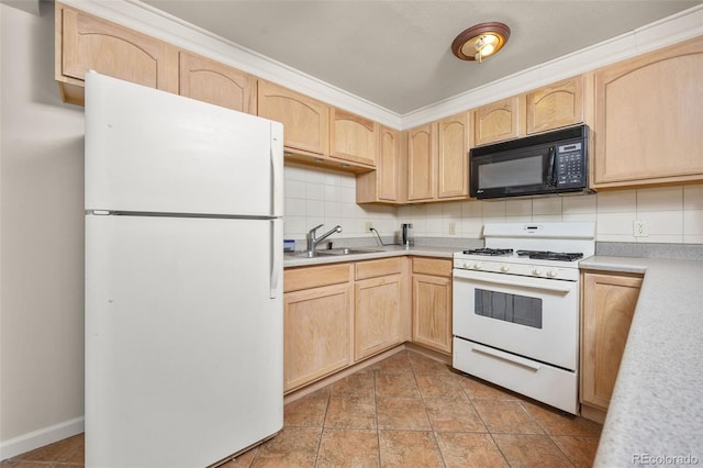 6868 Johnson St, Arvada, CO 80004 - kitchen featuring white appliances, light brown cabinetry, a sink, and light countertops
