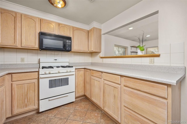 6868 Johnson St, Arvada, CO 80004 - kitchen with black microwave, white gas stove, light brown cabinetry, light tile patterned floors, and tasteful backsplash