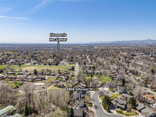 6868 Johnson St, Arvada, CO 80004 - aerial overview of property's location with nearby suburban area and a mountainous background