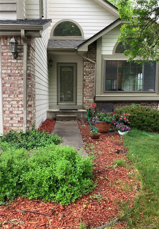 6868 Johnson St, Arvada, CO 80004 - doorway to property with brick siding
