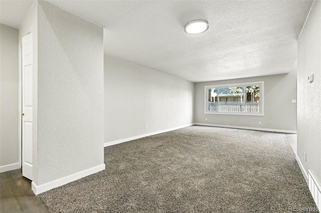 2976 S Parker Ct, Aurora, CO 80014 - spare room with a textured wall, a textured ceiling, and wood finished floors