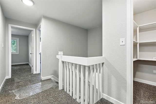 2976 S Parker Ct, Aurora, CO 80014 - corridor with an upstairs landing, carpet floors, and a textured wall