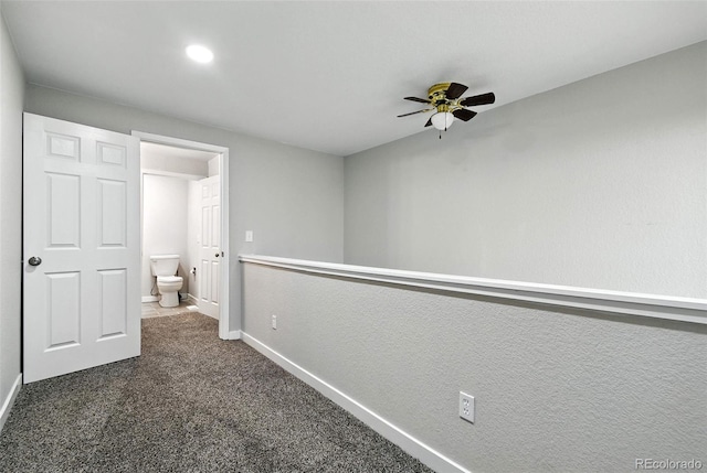 2976 S Parker Ct, Aurora, CO 80014 - corridor featuring dark carpet and baseboards