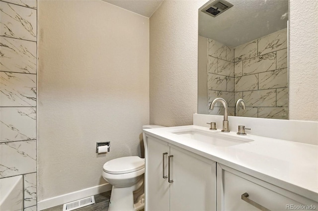 2976 S Parker Ct, Aurora, CO 80014 - full bath featuring vanity, wood finished floors, a shower, and a textured wall