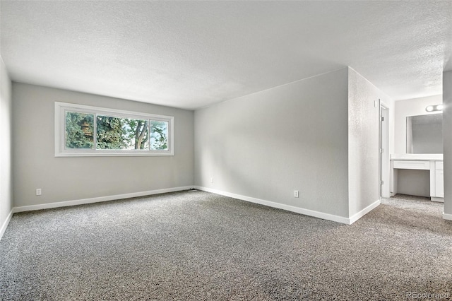 2976 S Parker Ct, Aurora, CO 80014 - empty room featuring a textured ceiling and carpet floors