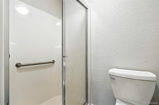2976 S Parker Ct, Aurora, CO 80014 - full bathroom featuring a stall shower and a textured wall