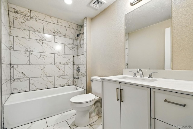 2976 S Parker Ct, Aurora, CO 80014 - bathroom featuring a textured wall, vanity, shower / bath combination, and marble look tiles