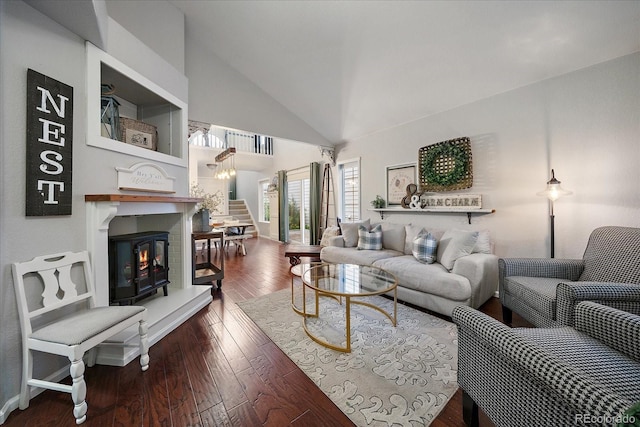5107 Pasadena Way, Broomfield, CO 80023 - living area featuring stairs, a glass covered fireplace, wood-type flooring, and high vaulted ceiling