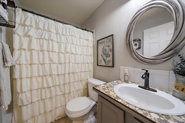 5107 Pasadena Way, Broomfield, CO 80023 - full bathroom featuring a textured wall, vanity, and a shower with curtain