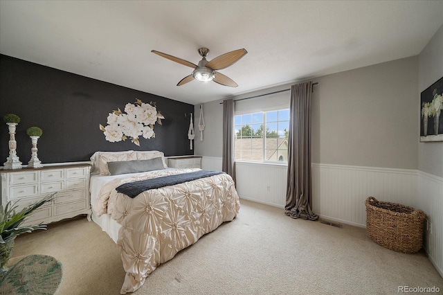 5107 Pasadena Way, Broomfield, CO 80023 - bedroom with wainscoting, light carpet, and a ceiling fan