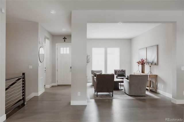 living room featuring dark hardwood / wood-style flooring and plenty of natural light