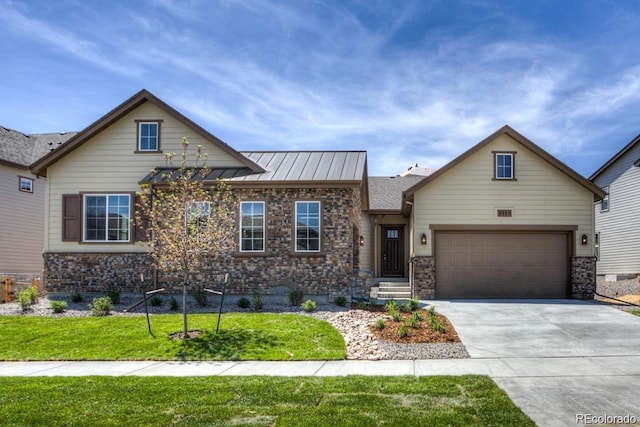 view of front facade with a front lawn, concrete driveway, metal roof, a garage, and a standing seam roof