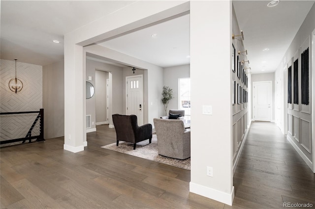 interior space featuring recessed lighting, dark wood-style floors, visible vents, and baseboards