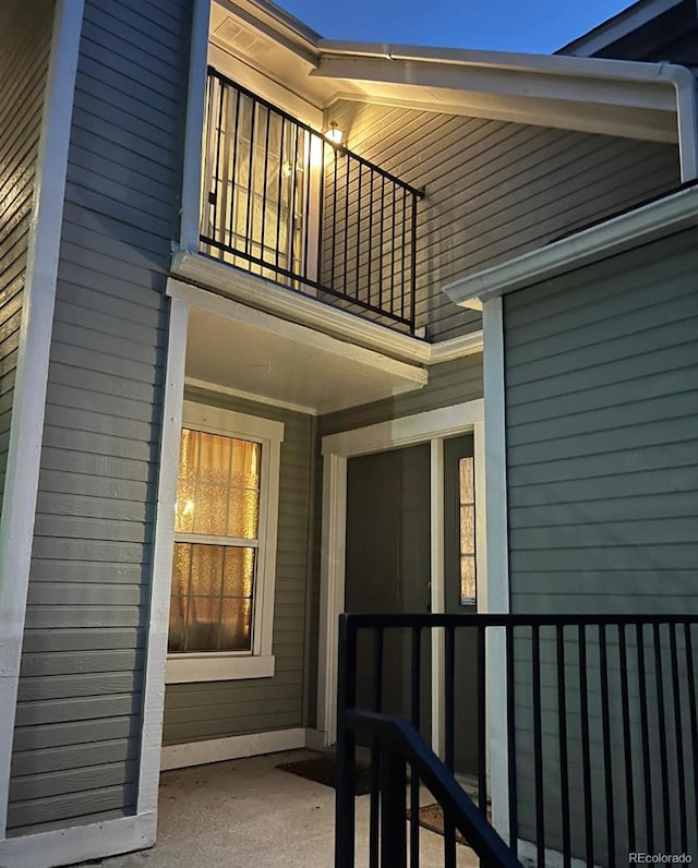 6711 S Ivy Way Unit B5, Centennial, CO 80112 - view of exterior entry featuring a balcony