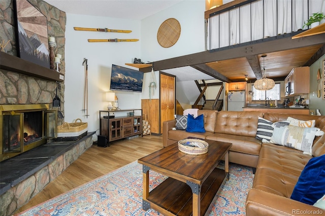 living room featuring a fireplace and light hardwood / wood-style floors